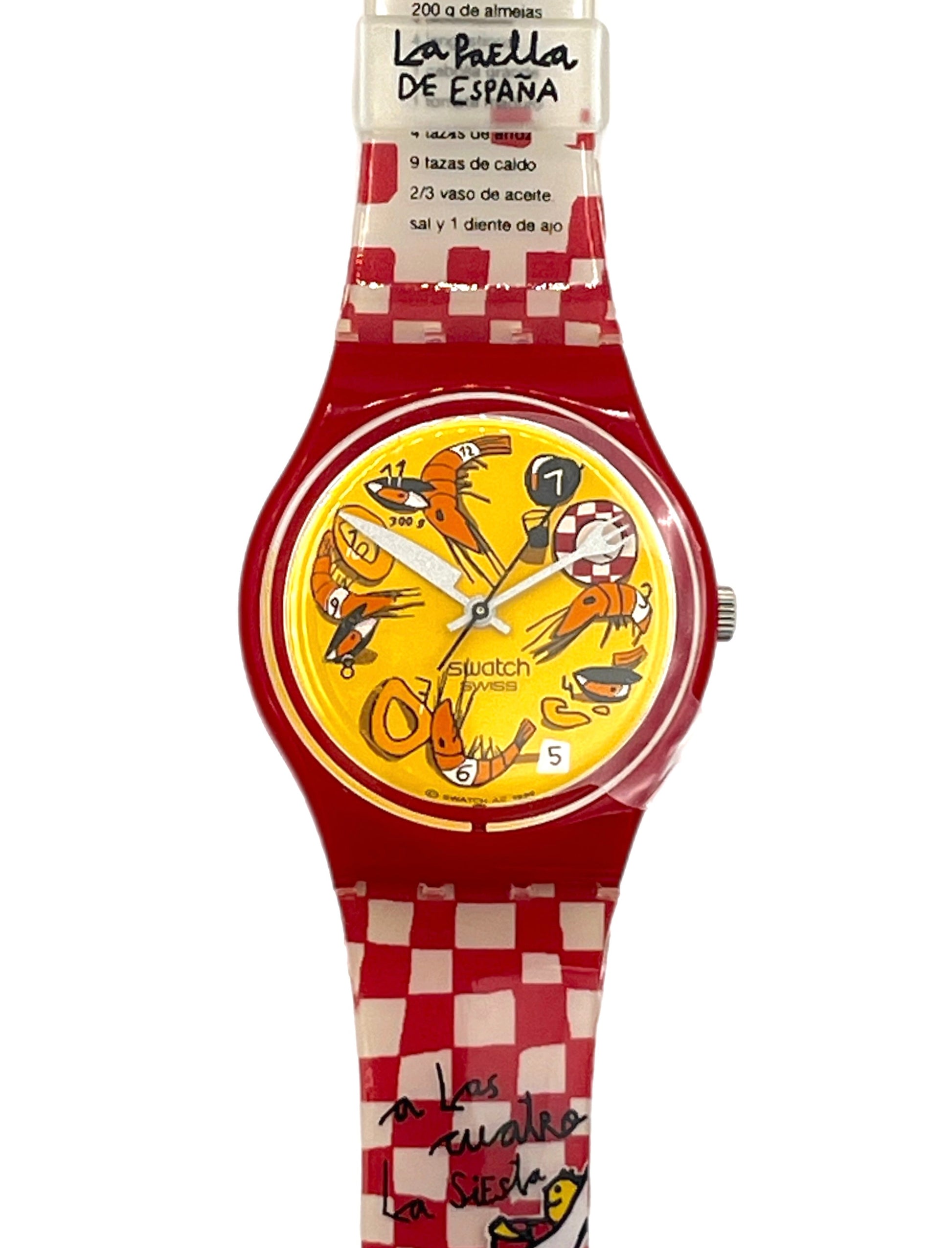 A Swatch La Paella de España Swatch watch featuring a red and white checkered strap, a red case, and a yellow dial decorated with colorful Spanish seafood illustrations.