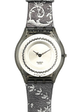 Swatch London analog watch with a textured gray and white patterned strap, a silver-toned case, and a white dial featuring a black decorative border.