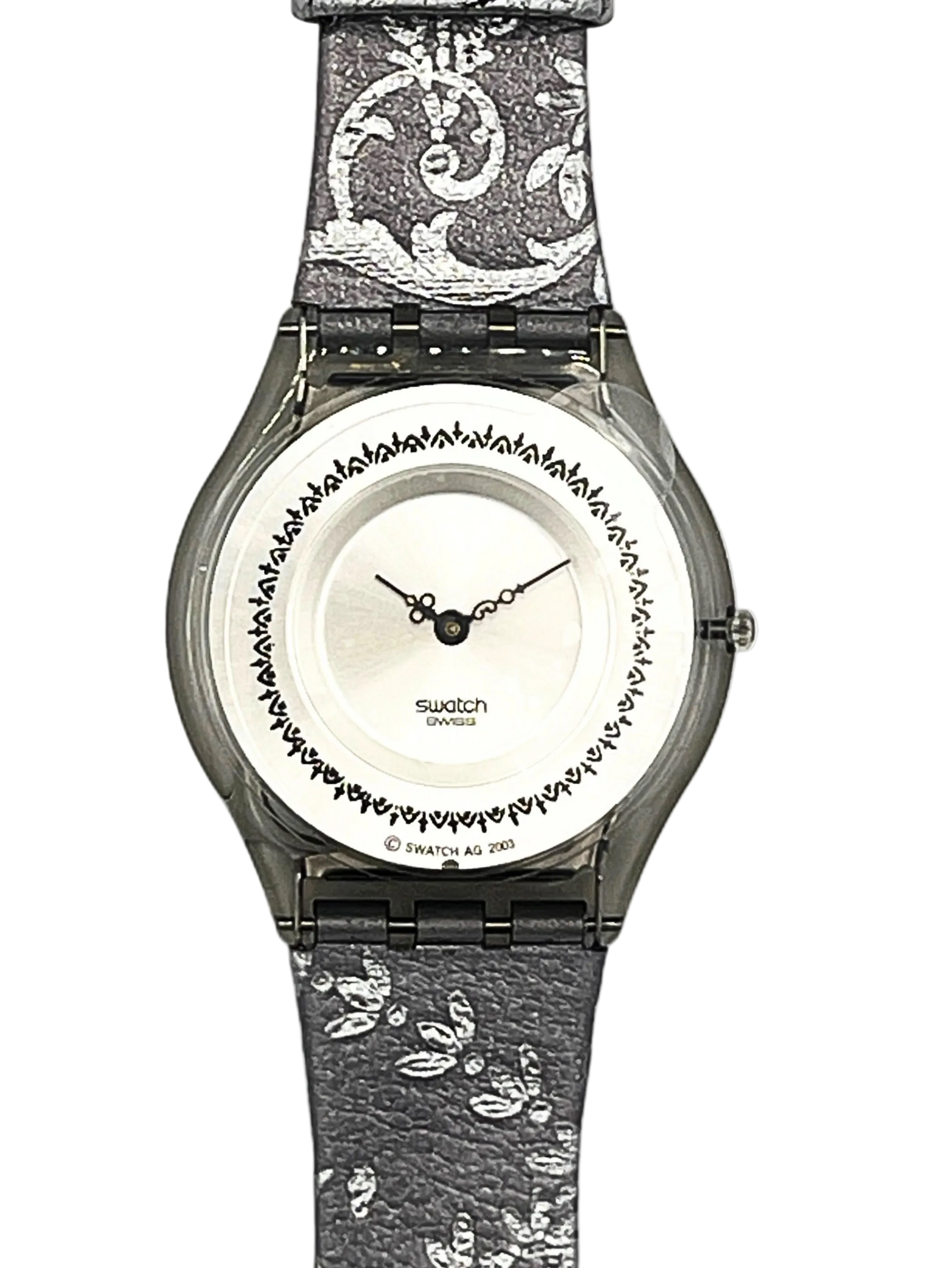 Swatch London analog watch with a textured gray and white patterned strap, a silver-toned case, and a white dial featuring a black decorative border.