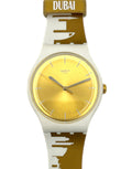 Watch with gold face and white and brown strap on a white background
