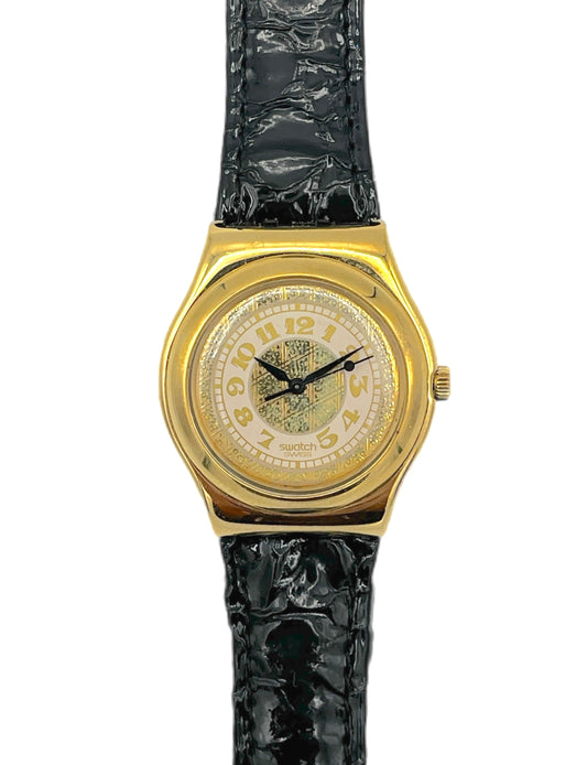 Gold watch with a black strap on a white background