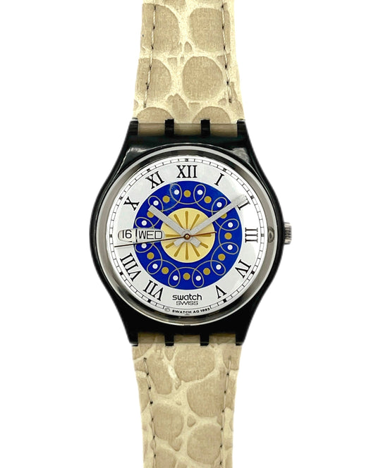 Swatch watch with a unique face and beige patterned strap on a white background