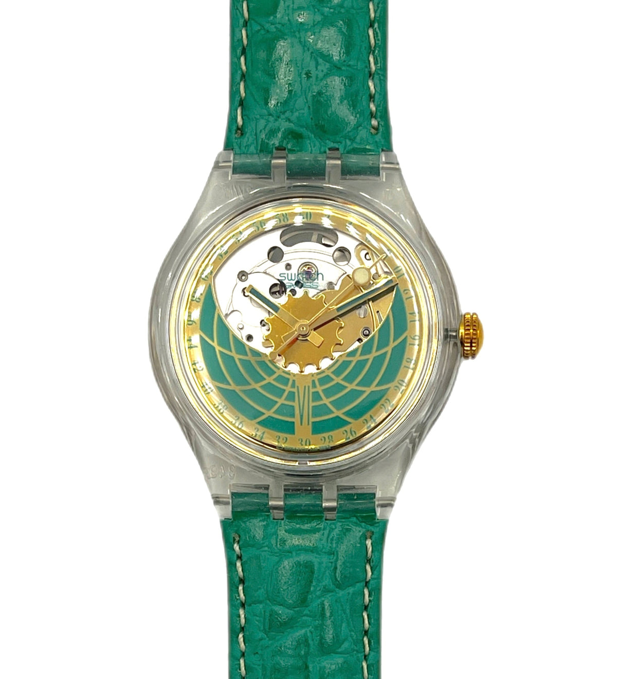 Watch with green strap and gold and silver face on a white background