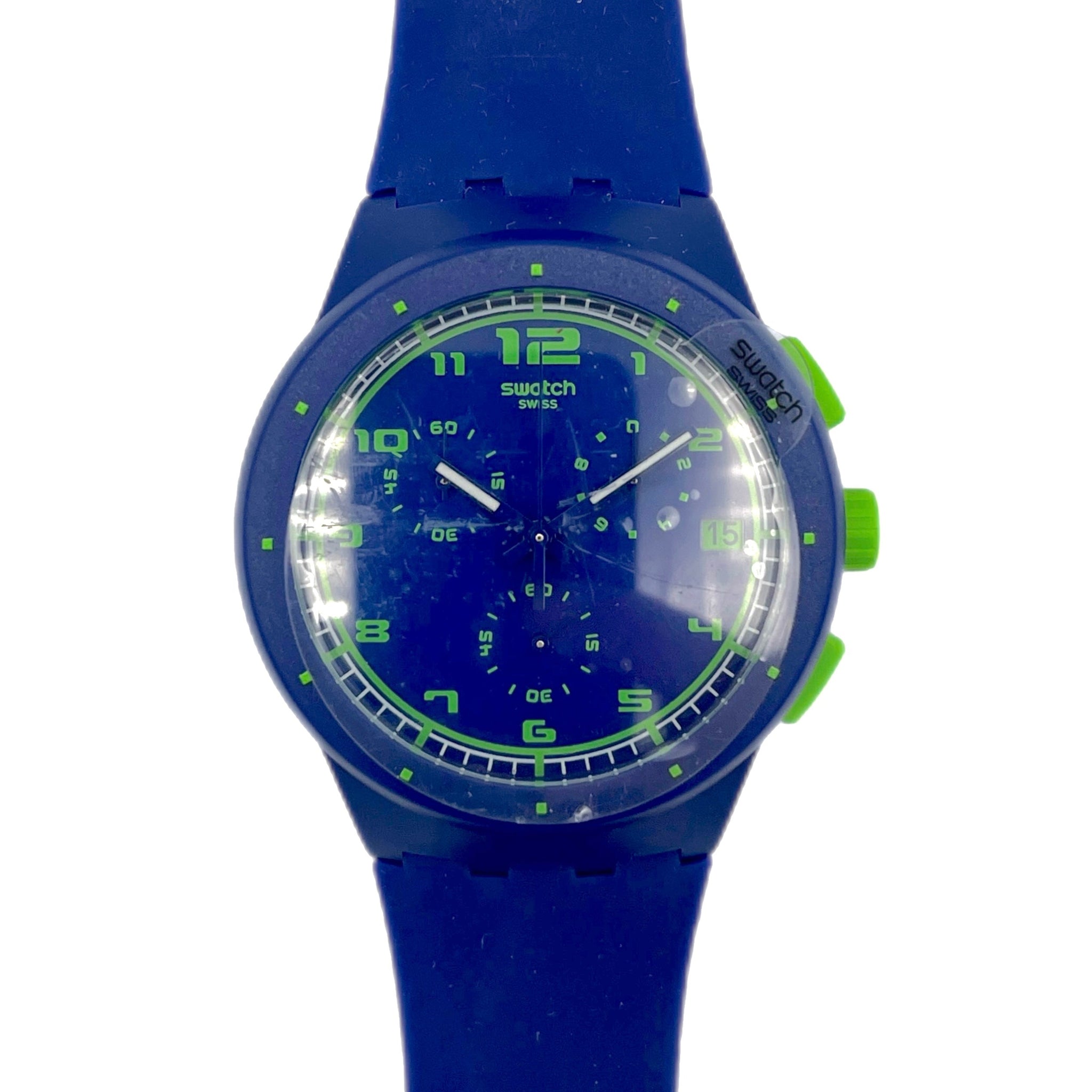 Blue Swatch watch with green accents on a white background