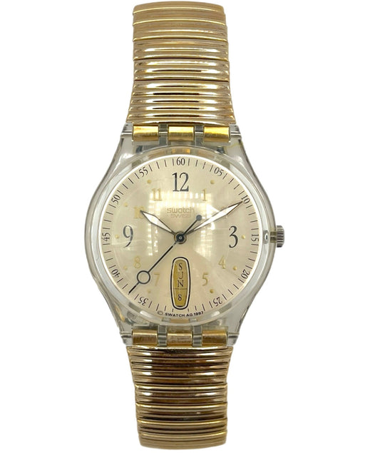 Gold and clear wristwatch on a white background