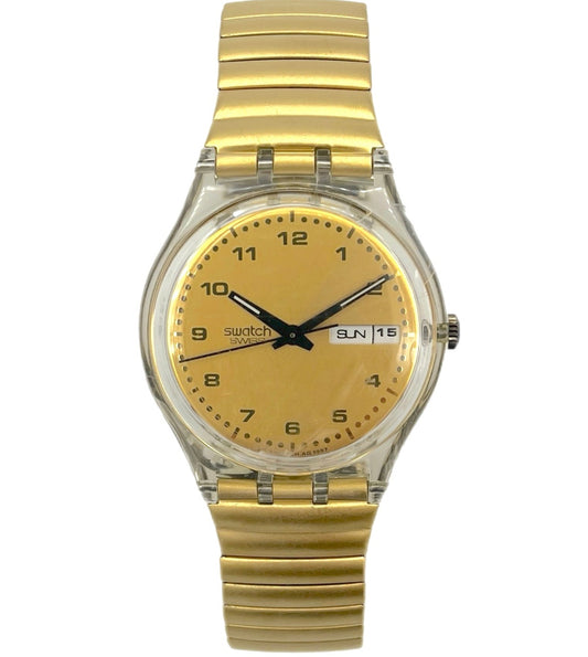 Gold wristwatch with a clear face on a white background