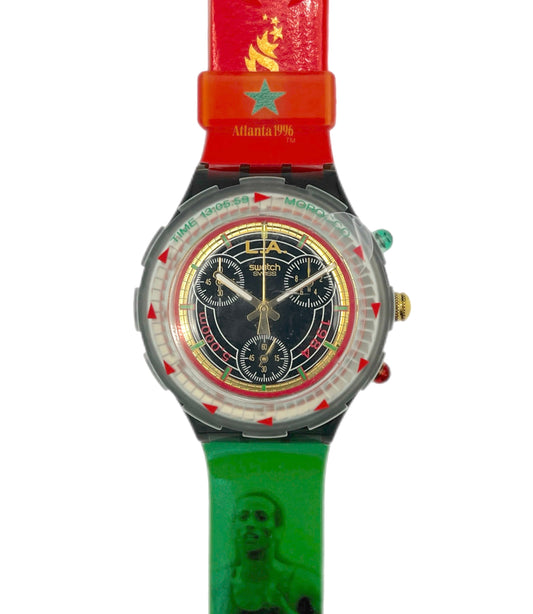 Multicolored watch with a red strap and green case on a white background