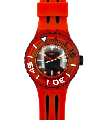 Red wristwatch with a clear face on a white background