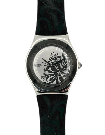 Swatch watch with black floral design on a white background