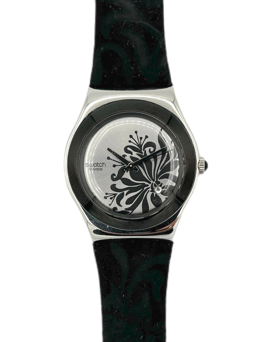 Swatch watch with black floral design on a white background