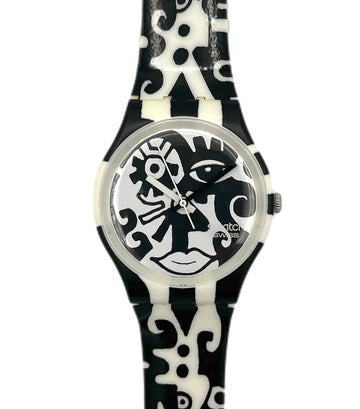 Black and white patterned watch with a unique face design on the dial against a white background