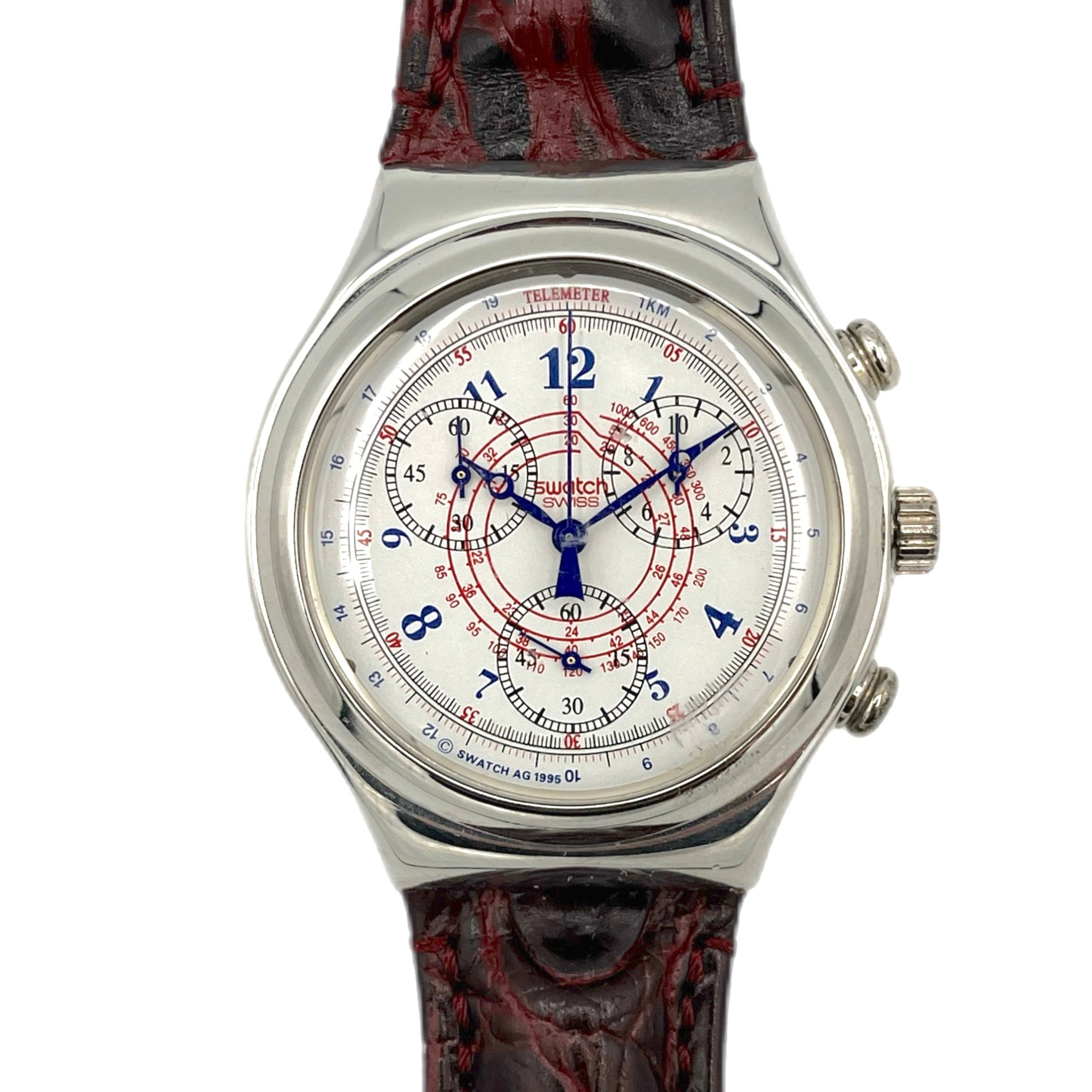 Watch with a detailed face and red and black strap on a white background