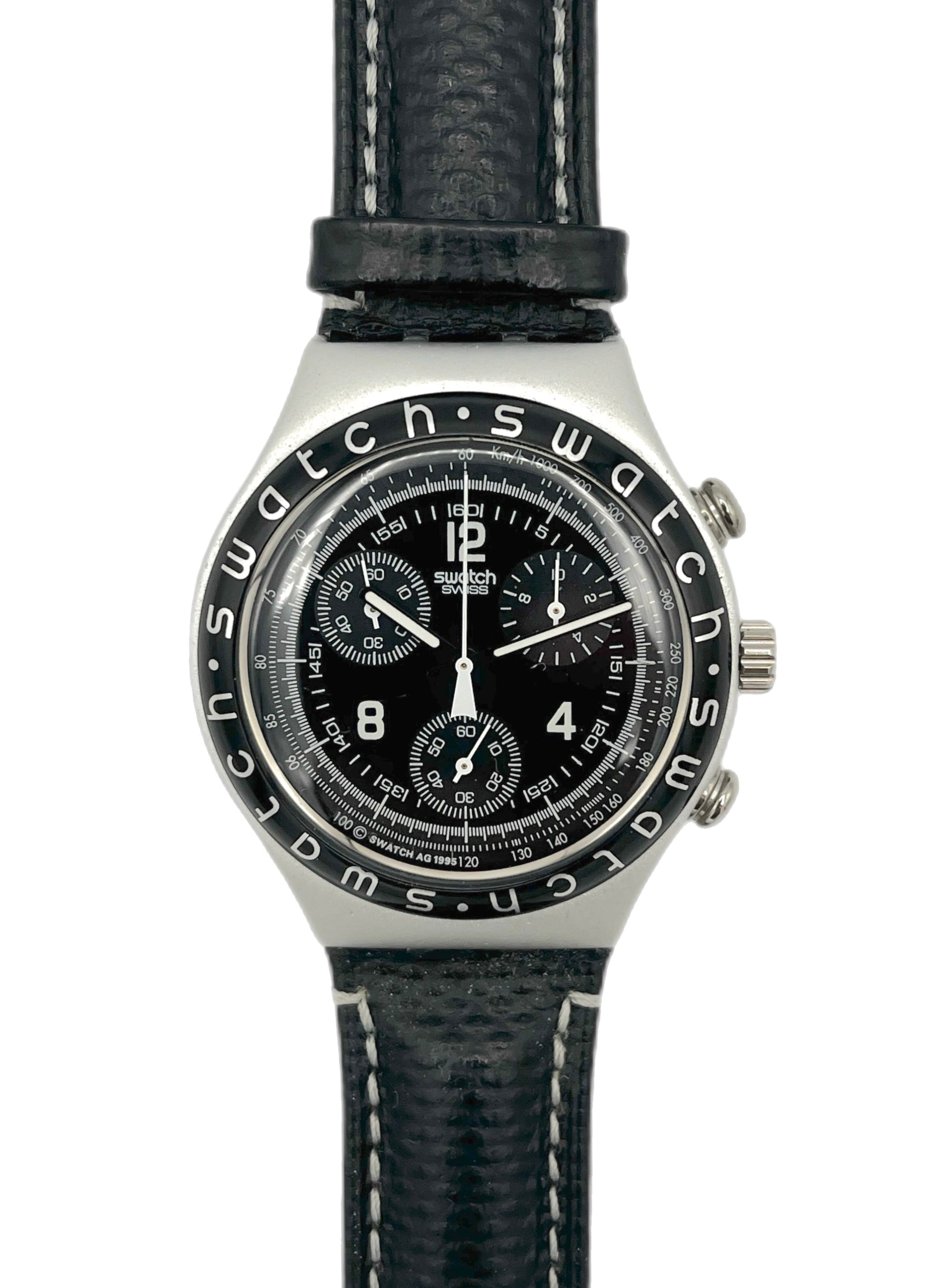 Swatch watch with black face and leather strap on a white background