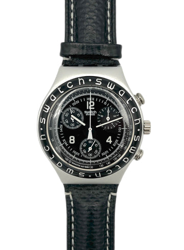 Swatch watch with black face and leather strap on a white background