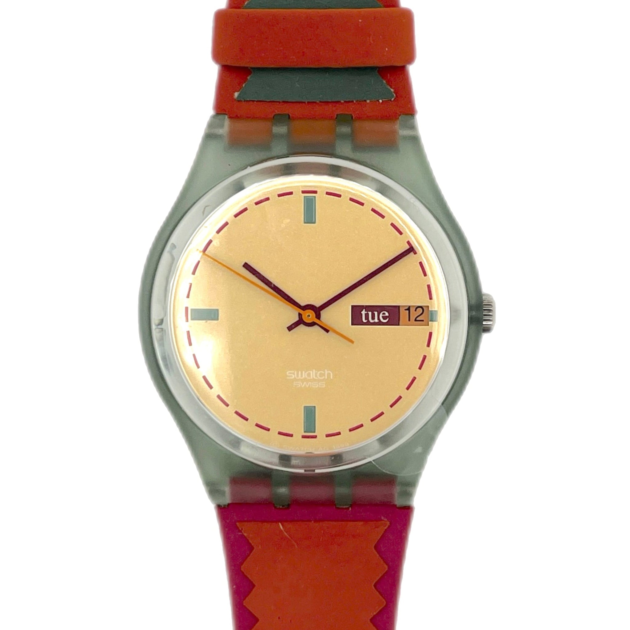 Wristwatch with red strap and beige dial on a white background