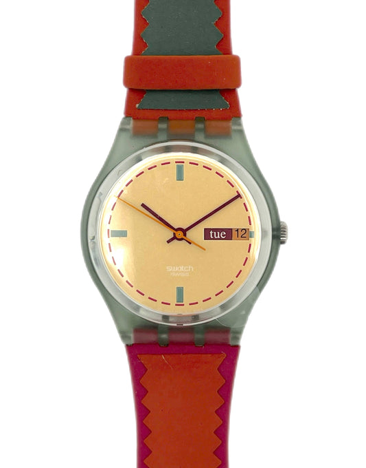 Wristwatch with red strap and beige dial on a white background