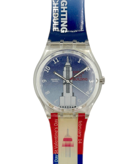 Wristwatch with a colorful strap featuring text and graphics on a white background