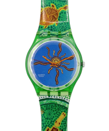 Swatch watch with a green strap featuring a turtle design on a white background