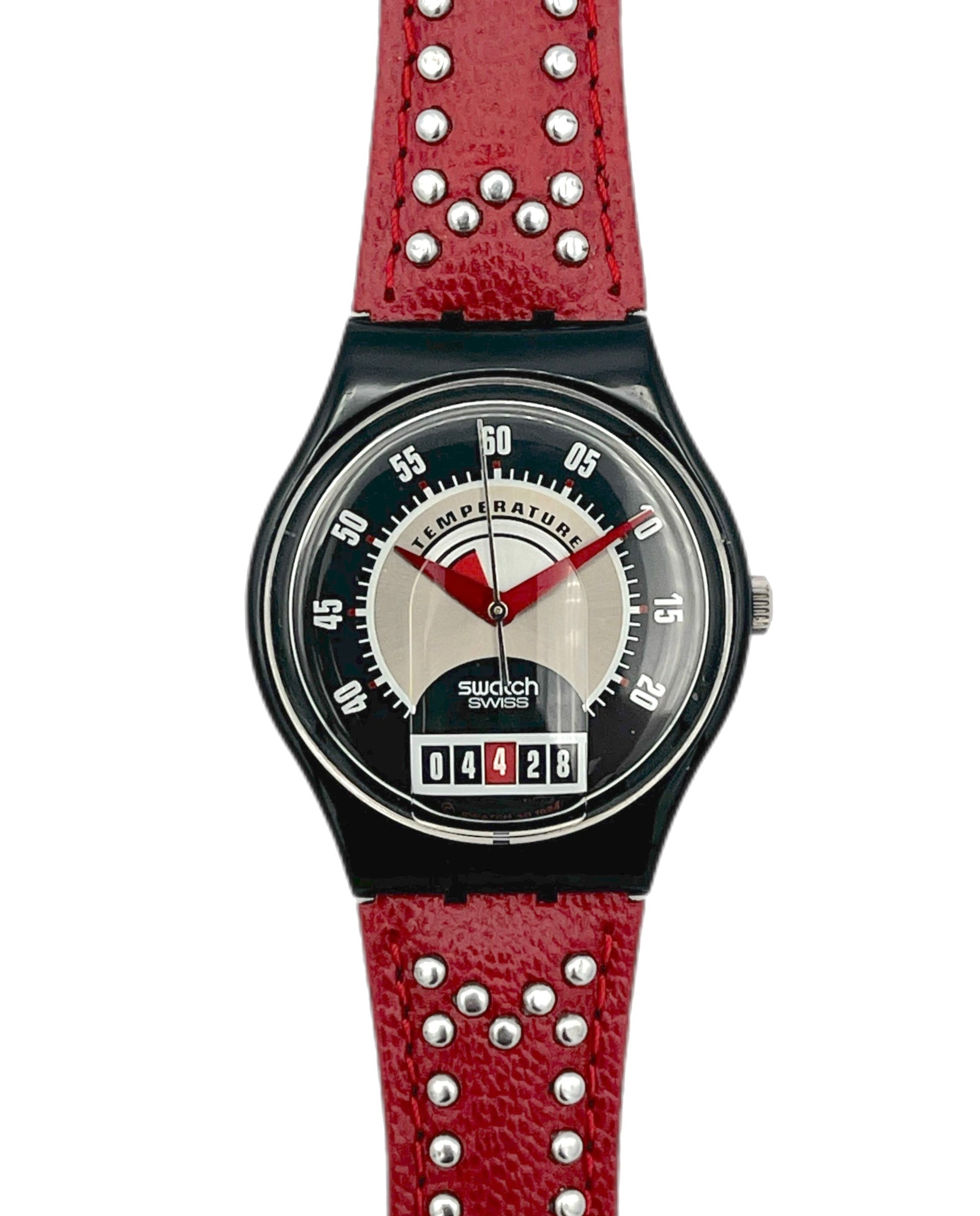Swatch watch with red strap and black dial on a white background
