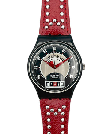 Swatch watch with red strap and black dial on a white background