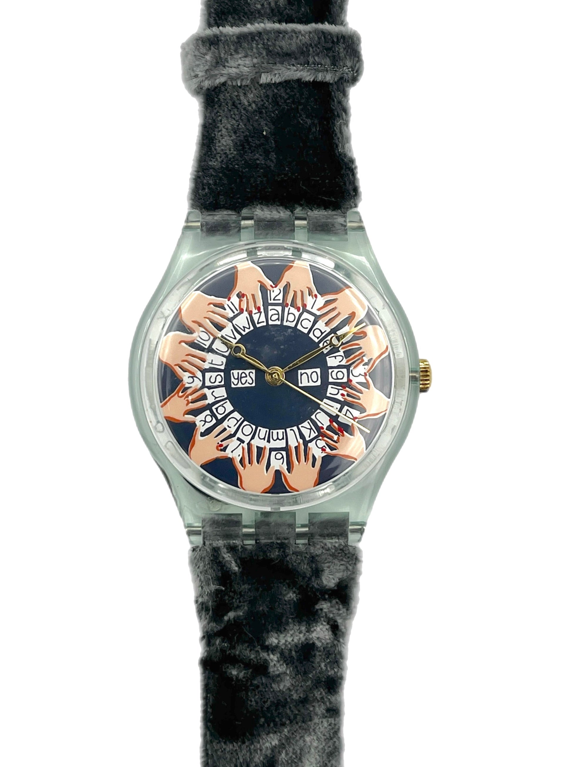 Watch with a unique face featuring hands and a black strap on a white background