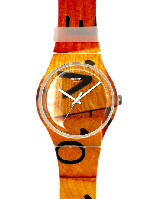 Wooden Swatch watch with black abstract design on a white background