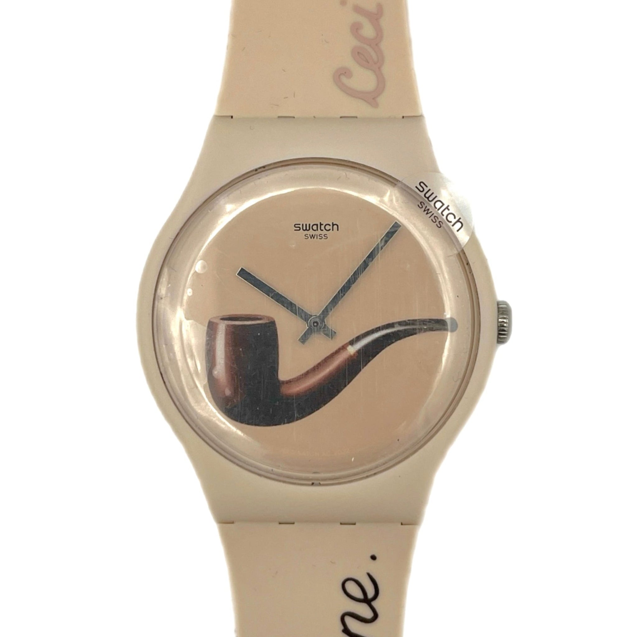 Beige Swatch watch with a pipe design by Magritte SO29Z124