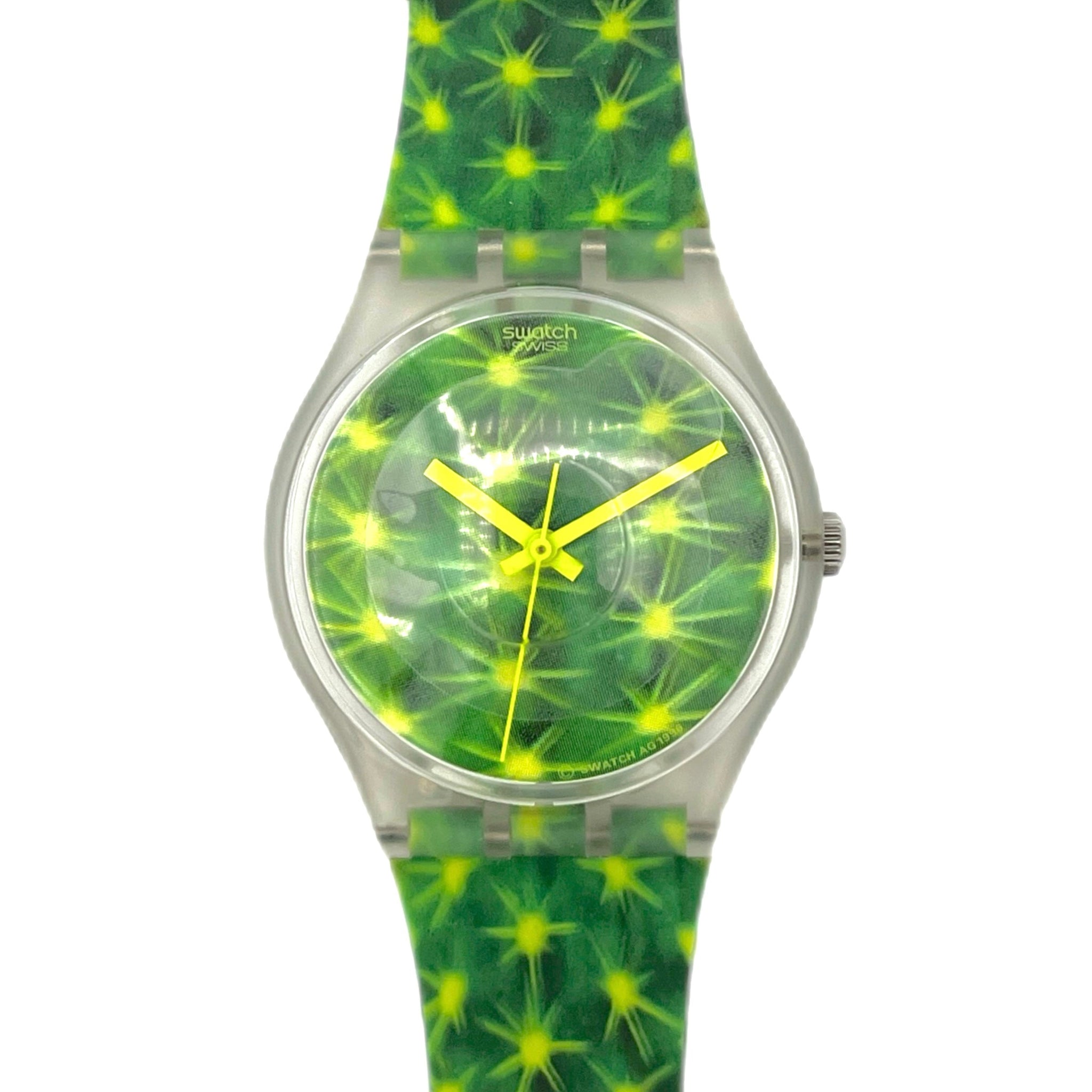 Green and yellow patterned watch with a clear strap on a white background