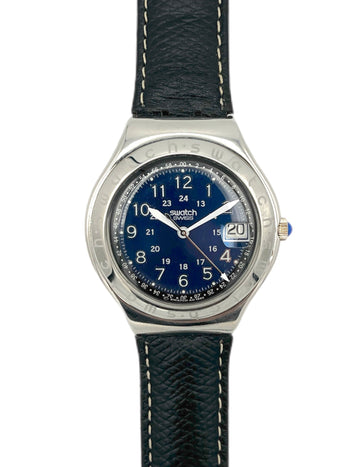 Swatch watch with blue dial and black strap on a white background