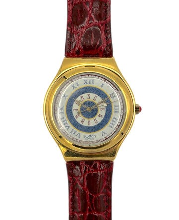 Gold watch with a red strap on a white background