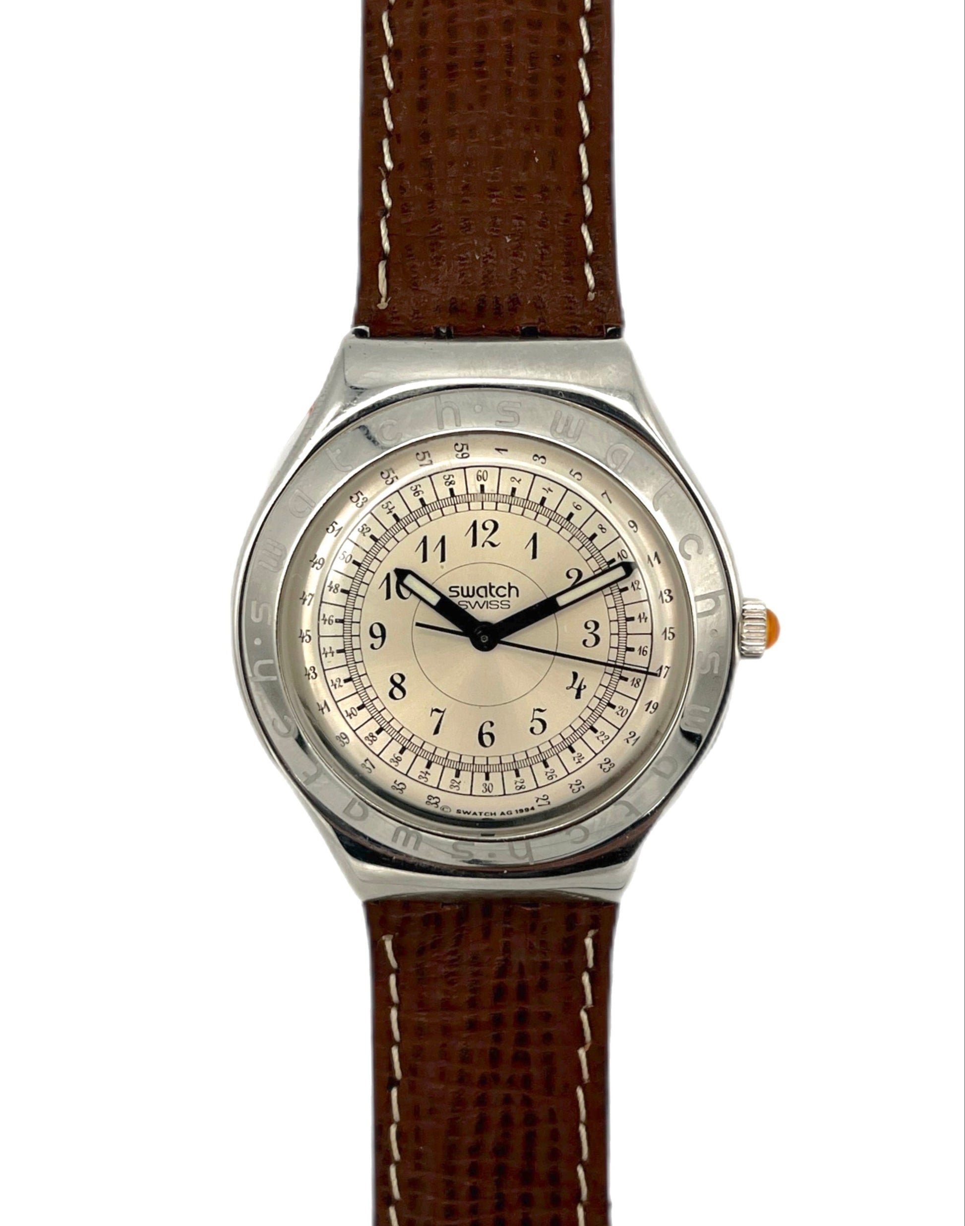 Swatch watch with brown strap on a white background