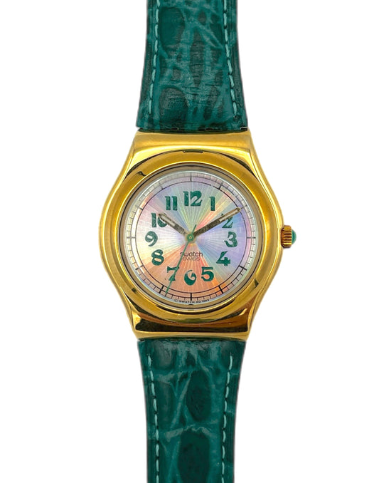 Wristwatch with gold case and green strap on a white background