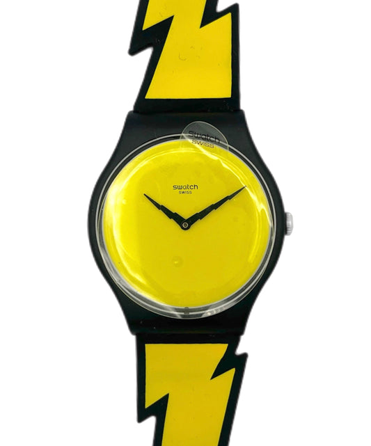 Wristwatch with yellow face and black lightning bolt design on a white background
