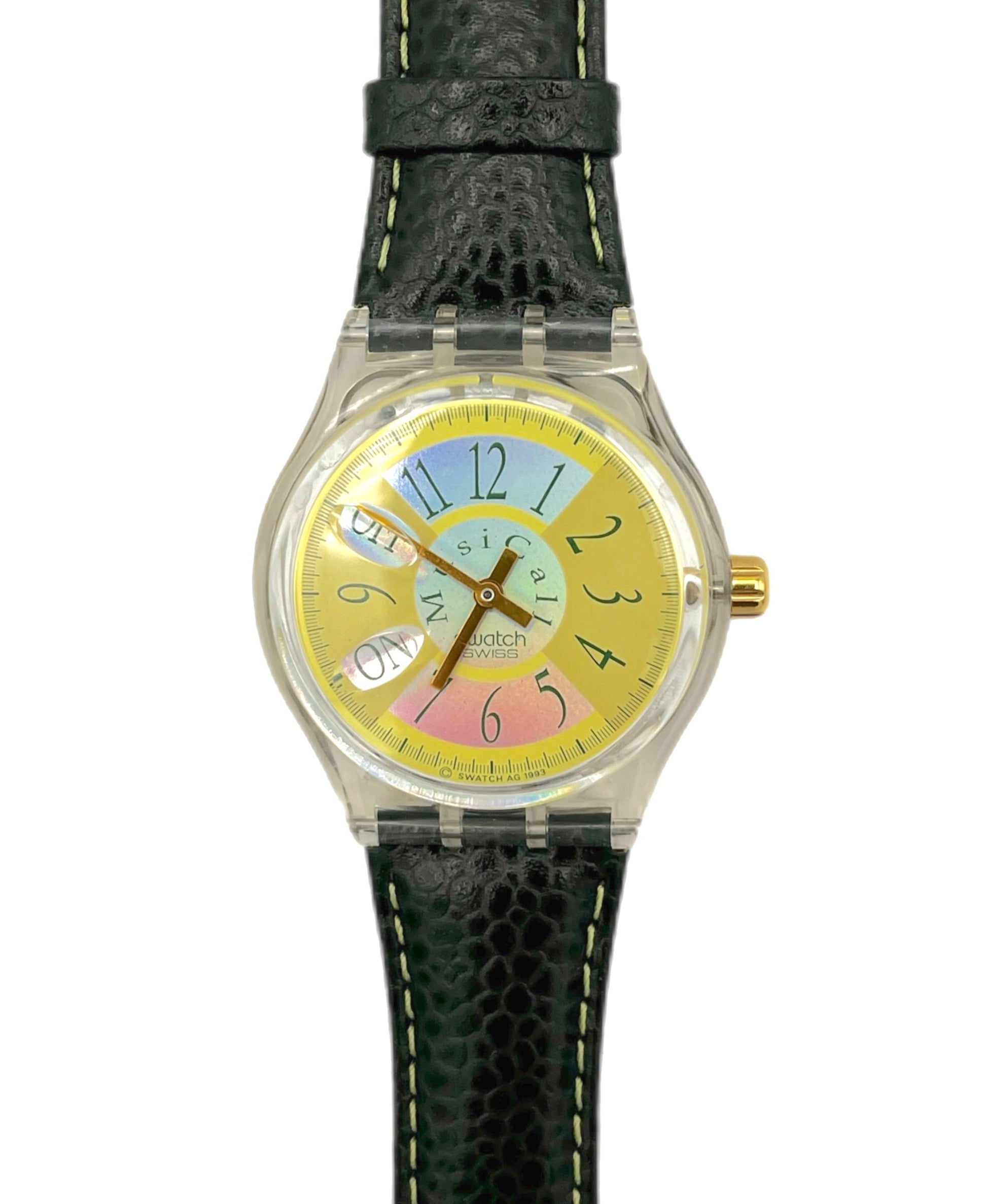Watch with a colorful face and black strap on a white background