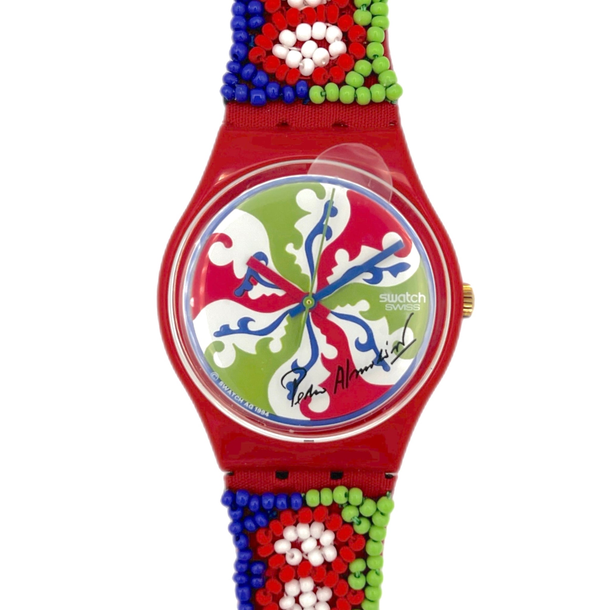 Colorful watch with a red strap featuring bead patterns on a white background