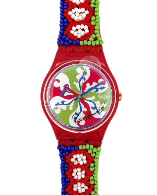 Colorful watch with a red strap featuring bead patterns on a white background