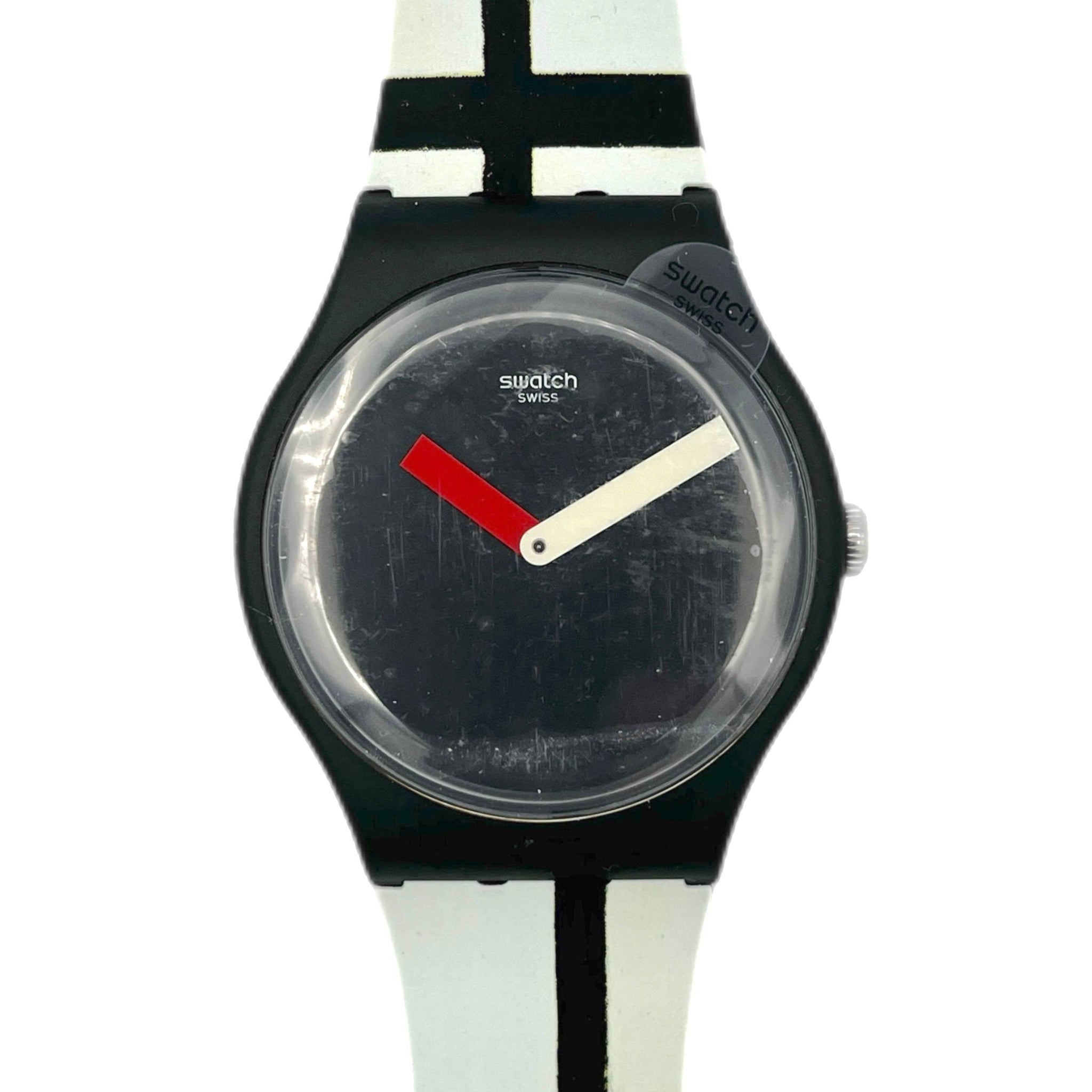 Swatch watch with black face and colorful strap on a white background