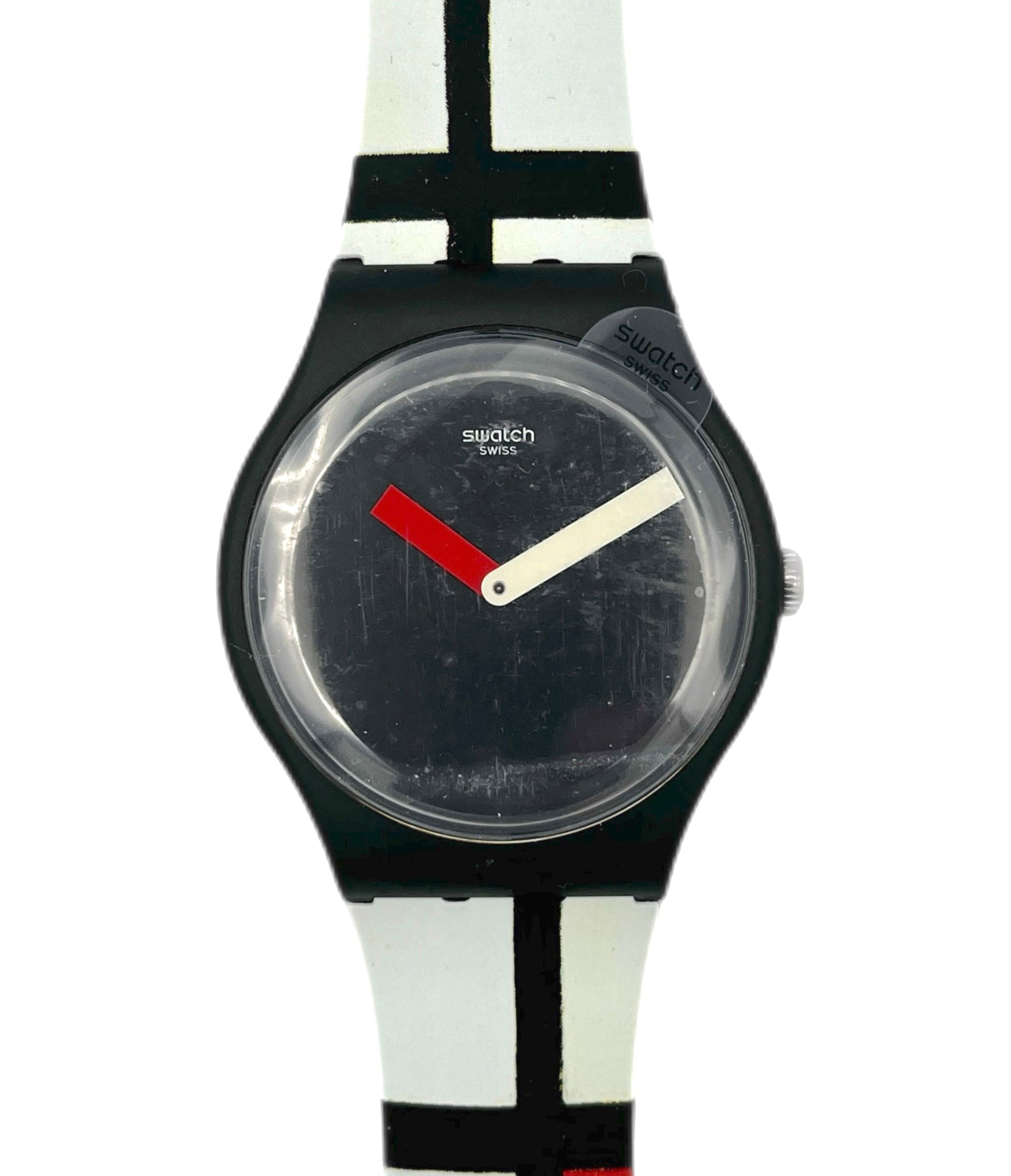 Swatch watch with black face and colorful strap on a white background
