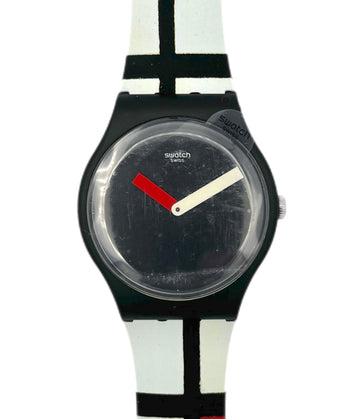 Swatch watch with black face and colorful strap on a white background