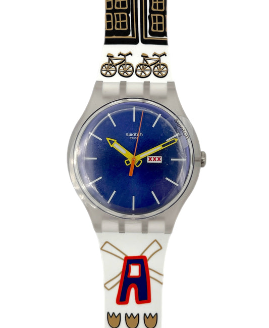 Swatch watch with colorful band featuring a bicycle design on a white background