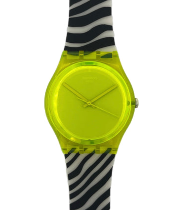 Swatch with a neon yellow face and black and white zebra pattern strap on a white background