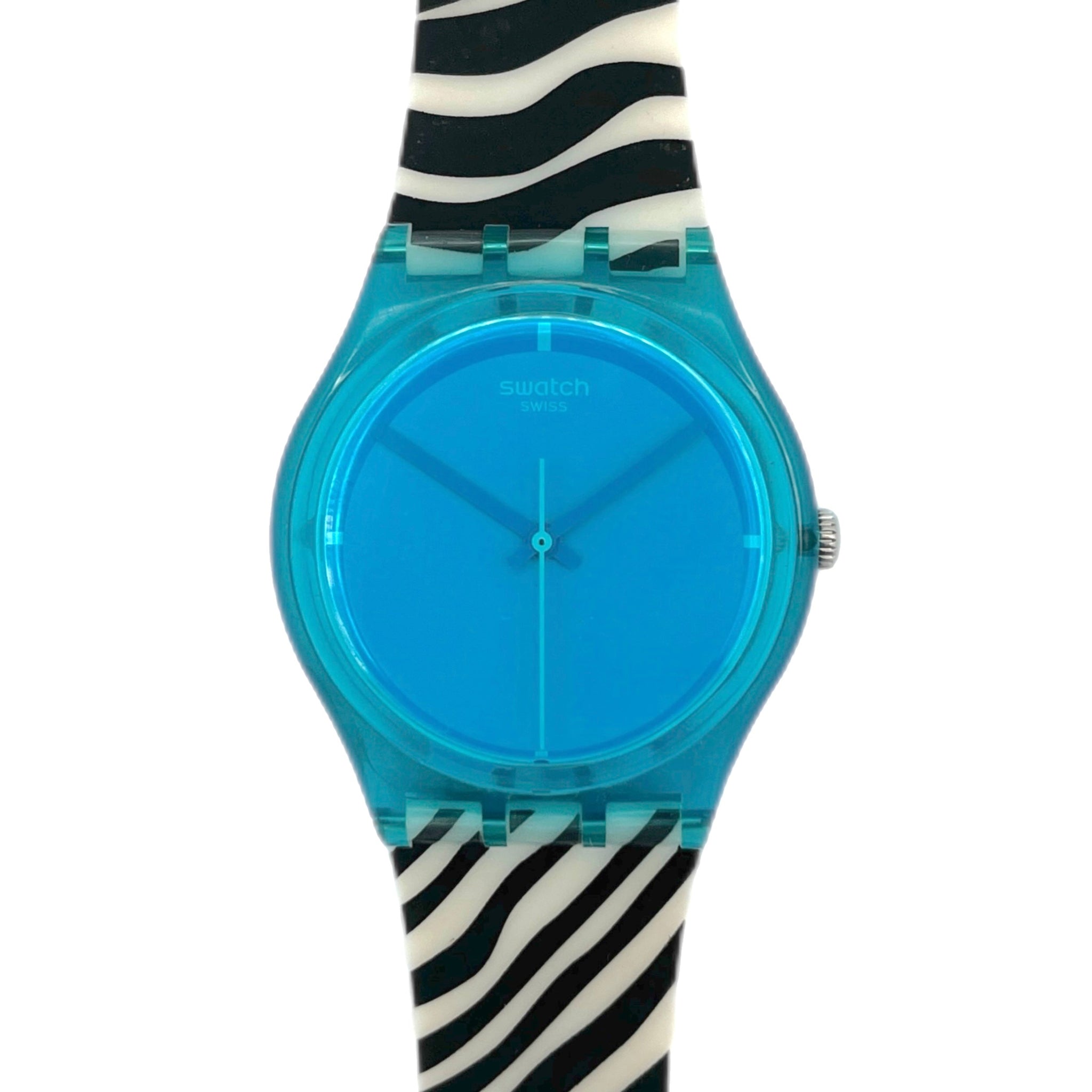 Swatch watch with blue face and zebra-striped strap on a white background