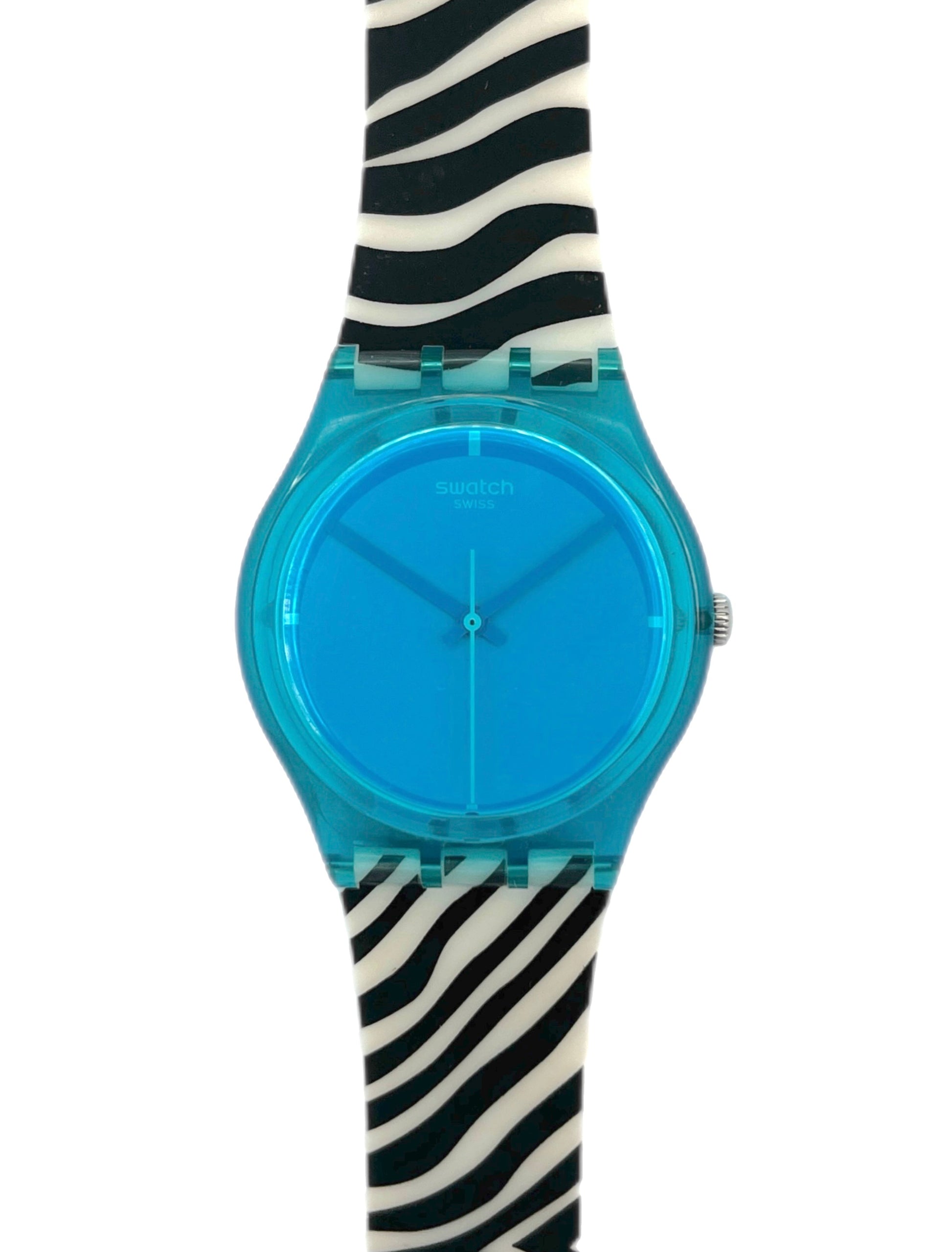 Swatch watch with blue face and zebra-striped strap on a white background