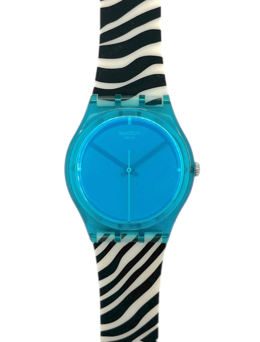 Swatch watch with blue face and zebra-striped strap on a white background
