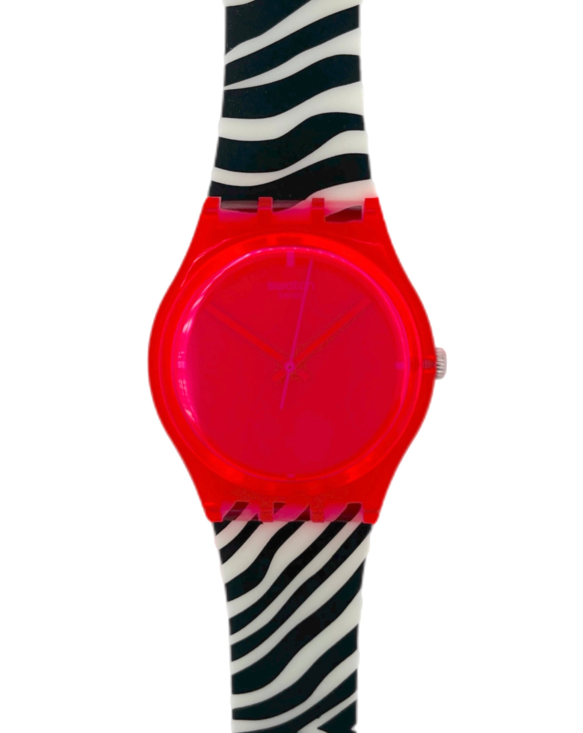 Pink neon Swatch with a zebra-patterned strap on a white background