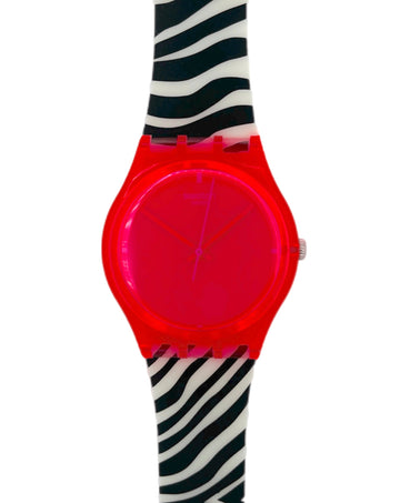 Pink neon Swatch with a zebra-patterned strap on a white background