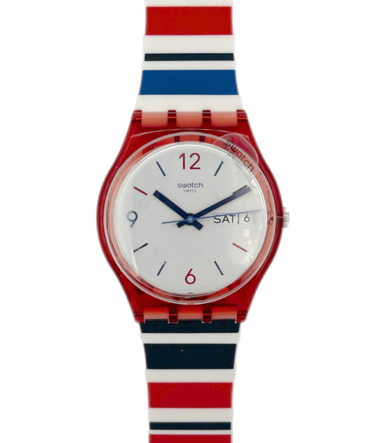Swatch watch with a red, white, and blue striped strap on a white background