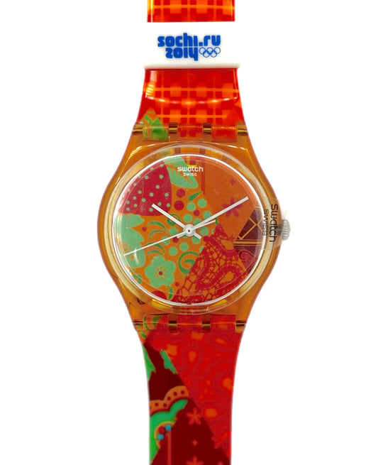 Colorful Swatch watch with a patterned face and red band on a white background