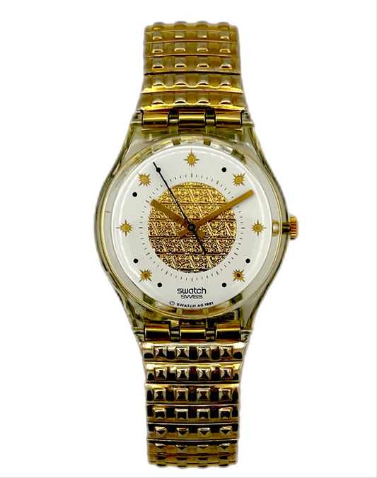 Gold Swatch watch on a white background