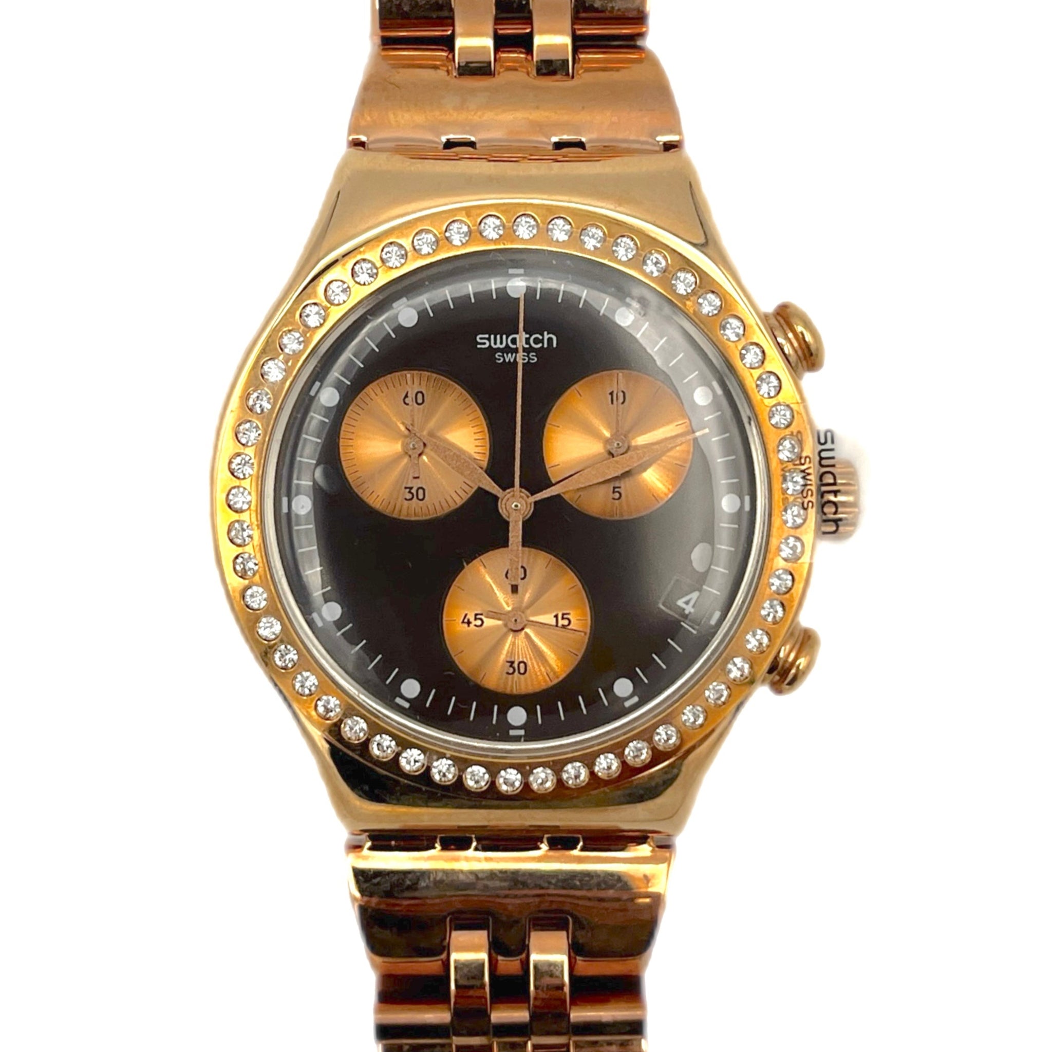 Gold watch with a black face and diamond-studded bezel on a white background